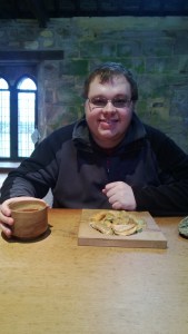 Cameron eating his Monk's meal at Fountains Abbey