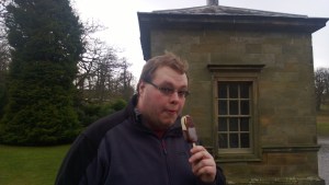 Cameron enjoying an ice cream in the freezing wind at Studley Royal!